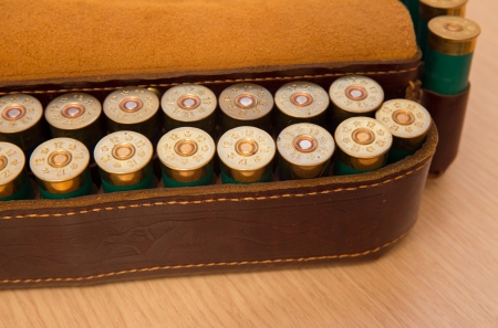 An old cartridge leather belt with shotgun shells