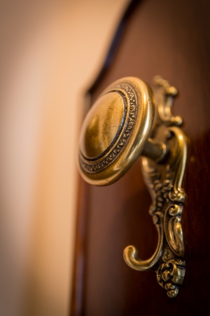 Old-fashioned golden coat hook in a lobbyの写真素材