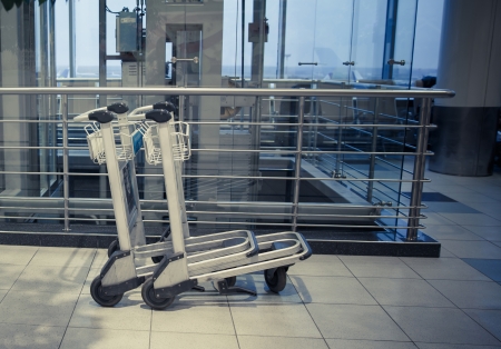 two trolleys in empty hall of airport in Moscow Domodedovoのeditorial素材