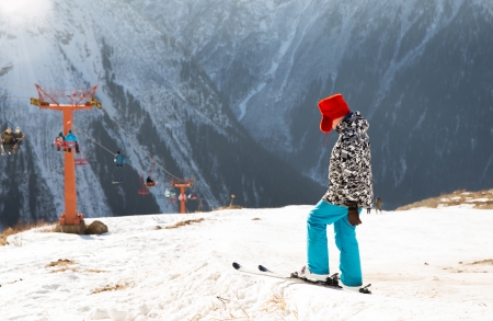 a person skiing high in the mountainsの写真素材