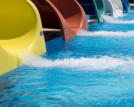 Colorful waterpark tubes and a swimming pool. Outdoor shotの写真素材