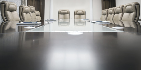 conference room with wooden table and beige leather armchairsの写真素材