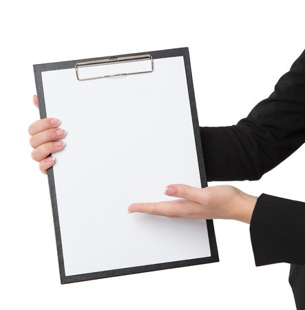 A pretty businesswoman carrying an empty clipboardの写真素材
