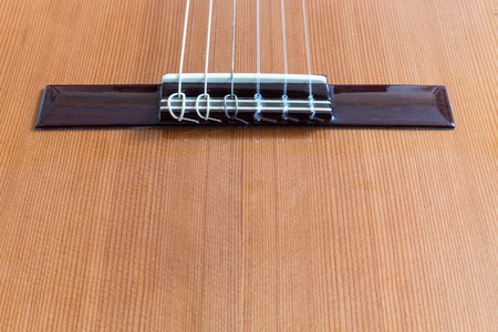 A classical guitar with six nylon strings