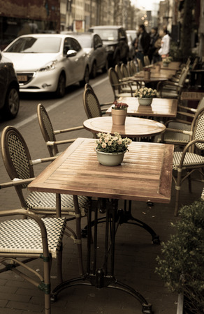 Small cafe tables outside on a streetの写真素材