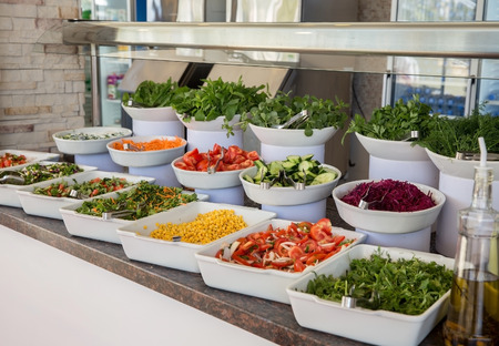 Variety of fresh salads in a buffetの写真素材