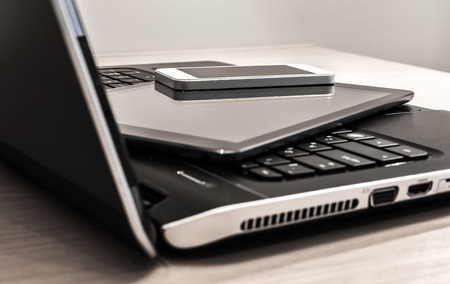Modern electronic devices - laptop, tablet and telephone