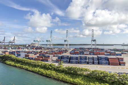 MIAMI, USA - SEPTEMBER 06, 2014 : The Port of Miami with containers and cranes on the background on September 06, 2014 in Miami.のeditorial素材
