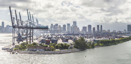 MIAMI, USA - SEPTEMBER 06, 2014 : The Port of Miami with containers and cranes on the background on September 06, 2014 in Miami.のeditorial素材