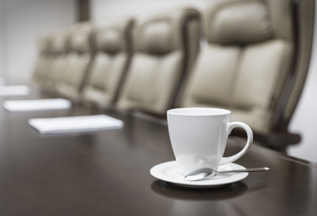 Closeup of  on table in empty corporate conference room before business meeting in office