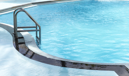 Metal ladder leading into the swimming pool