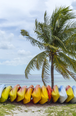 Bright coloured kayaks on the Bahamas beachの写真素材