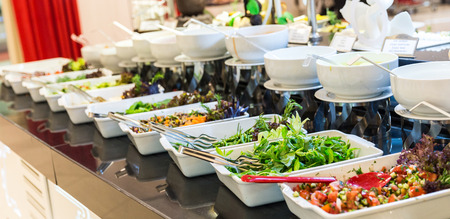 Variety of fresh salads in a buffetの写真素材