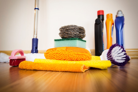 set of cleaning equipment on a wooden floorの写真素材