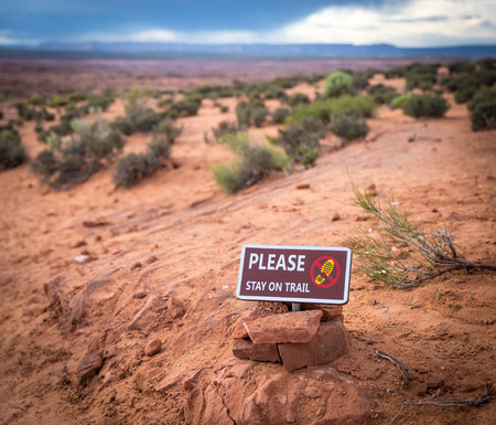 Please stay on trail Sign Warning that Hikers should stay on The Trail for Their Protectionの写真素材