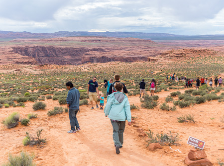 PAGE, ARIZONA - MAY 25: Hikers at Horseshoe Bend on May 25, 2015 in Page AZ,USA. Thousands of people from all over the world  visit this unique place every year.のeditorial素材