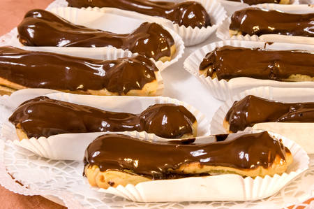 Mini vanilla eclairs with chocolate frosting