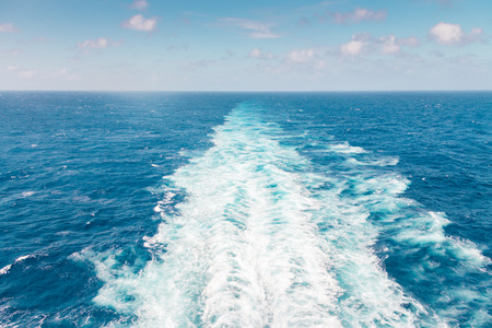 Cruise ship wake or trail on ocean surface, white trace
