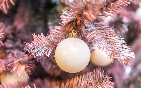 Pink Christmas tree with clasic holiday decorationの写真素材