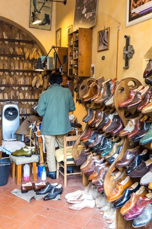 FLORENCE, ITALY, MAY 04, 2018: Fashion classical polished mens handmade shoes selling in shop in Florenceのeditorial素材