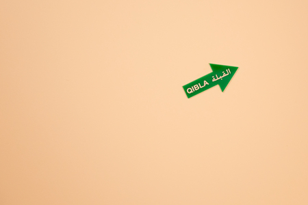 Qibla arrow sign for a Muslim prayer directionの写真素材