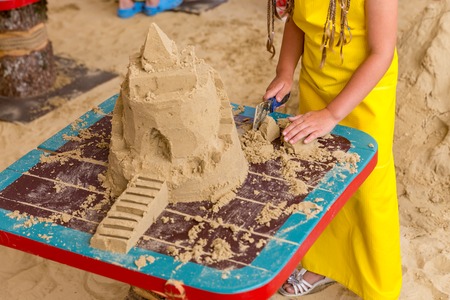 Sand castle made by kids on a craft lesson on beachの写真素材