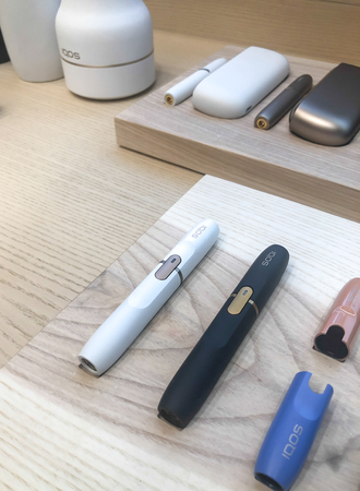 MOSCOW, RUSSIA - FEBRUARY 04, 2019: Iqos electronic cigarette philip morris in Iqos store in Moscowのeditorial素材