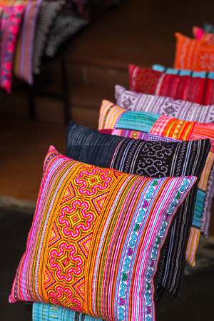 Colorful pillows at sales counter at asian marketの写真素材