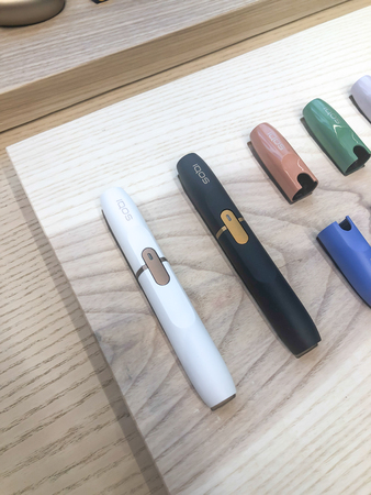 MOSCOW, RUSSIA - FEBRUARY 04, 2019: Iqos electronic cigarette philip morris in Iqos store in Moscowのeditorial素材