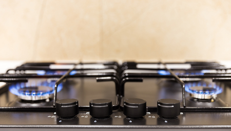 Gas burner on black modern kitchen stoveの写真素材