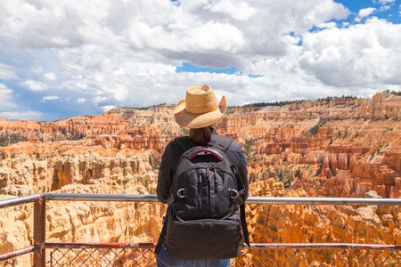 Woman wearing hat looking at the Bryce Canyon, Utah USAの写真素材