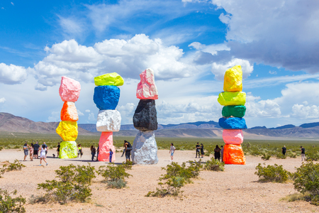 LAS VEGAS, NEVADA, USA - 12 MAY, 2019: Seven Magic Mountains art installation near Las Vegas city. Pillars made of neon colored boulders stand against barren desert background and blue sky.のeditorial素材