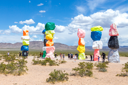 LAS VEGAS, NEVADA, USA - 12 MAY, 2019: Seven Magic Mountains art installation near Las Vegas city. Pillars made of neon colored boulders stand against barren desert background and blue sky.のeditorial素材