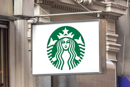 NEW YORK, USA - 16 MAY, 2019: Starbucks sign in a Starbucks restaurant in New York. Starbucks Corporation is an American coffee company and coffeehouse chainのeditorial素材