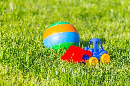 plastic toy car on a green grassの写真素材