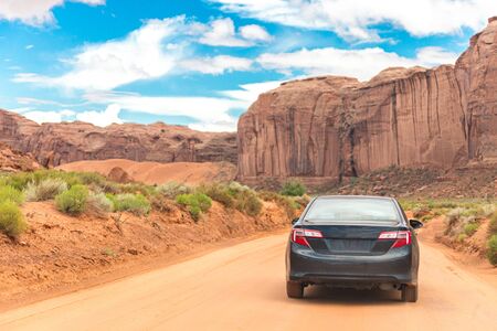 Offroading through the Monument Valley driving a carの写真素材