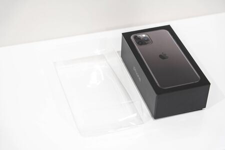 Moscow, Russia - September 24, 2019: New Apple iPhone 11 pro sealed in box over White Background
