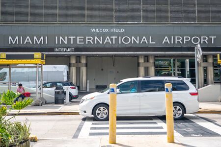 Miami, USA - September 21, 2019 - Miami international airport with flags of different countriesのeditorial素材