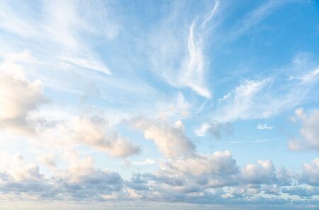 Blue sunset sky with nice white clouds