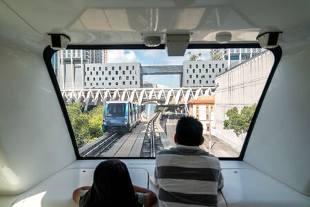 MIAMI - September 10, 2019: The fully automated Miami downtown train system with the city in the...