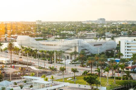Fort Lauderdale, Florida, USA - September 19, 2019: Luxury yacht parked on a canal with the sun coming down at Fort Lauderdale. Port of Fort Lauderdale with Sunset at the marina areaのeditorial素材