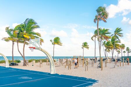 FORT LAUDERDALE, FLORIDA - September 20, 2019: People enjoying the beach gym at Fort Lauderdale in Florida on a sunny summer dayのeditorial素材