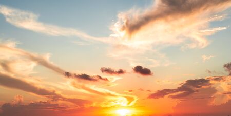 orange and red sunset or sunrise sky with clouds for background
