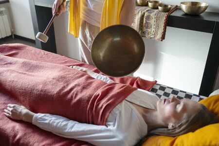 Tibetan singing bowls in sound therapy in spa centerの写真素材