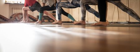 Aerobic Pilates in a gym, group class in a rowの写真素材
