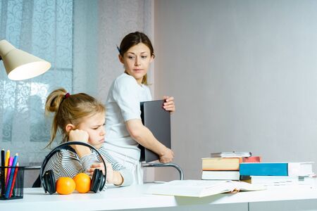 Mother Arguing With Teenage Daughter Over Online Activity taking away laptop