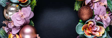 Beautiful unusual Christmas wreath decoration on black background. flat lay with copy space in centerの写真素材