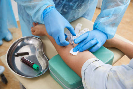 Nurse taking blood sample to make a test in laboratory