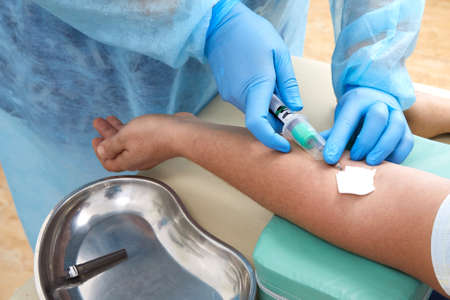 Nurse taking blood sample to make a test in laboratory