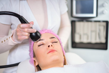 Young woman receiving treatment in cosmetology clinic. Cosmetology skin care. Aesthetic facial...